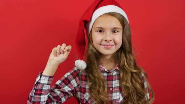 Christmas or New Years Background, Cute Young Girl Showing Countdown on Fingers