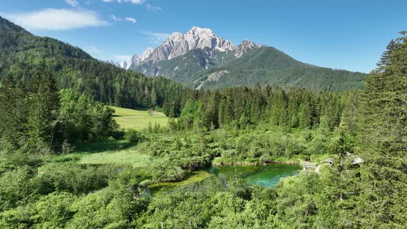 Flying over a nature park with mountains and a lake