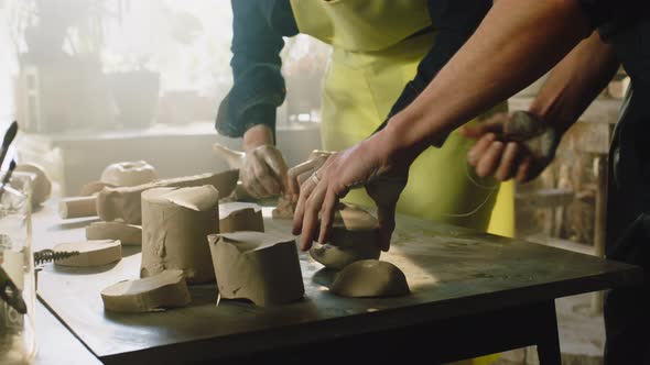 Potters Are Arranging Raw Clay Pieces