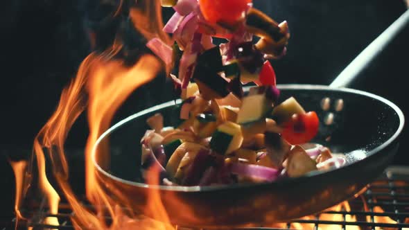 Vegetables Flying Into the Pan in Slow Motion