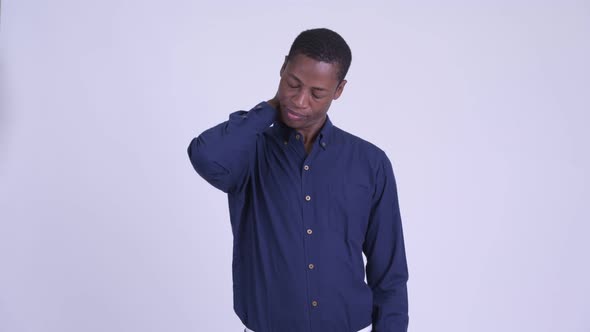Young Stressed African Businessman Having Neck Pain
