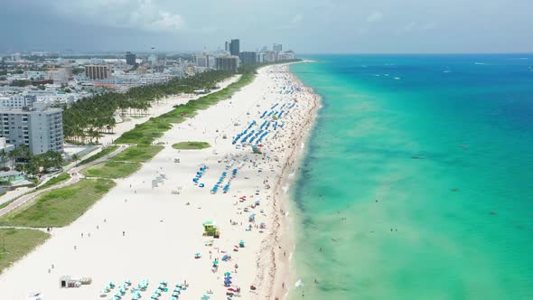 Incredible White Sandy Beach at the Transparent Green Blue Ocean Aerial Miami