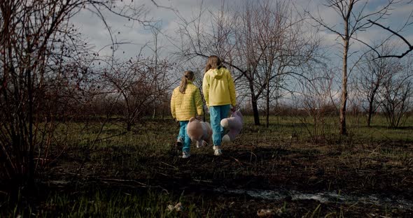 Kids Holding Fluffy Bears in Clothes in the Colors of the Ukrainian Flag