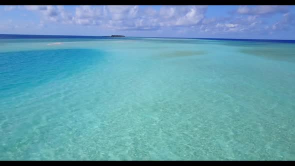 Aerial top down panorama of relaxing lagoon beach vacation by blue sea and white sand background of 
