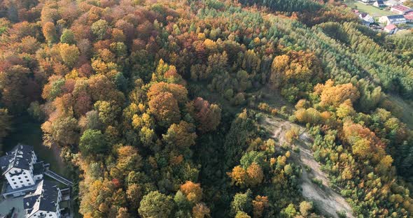 aerial view of autumn forest, nature landscape in Poland with private luxury isolated villa real est