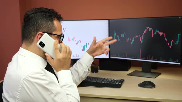 Stockbroker Making Phone Call About Stock Market Charts