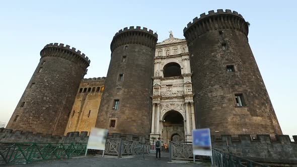 Male Tourist Walking to Beautiful Medieval Maschio Angioino Castle in Naples