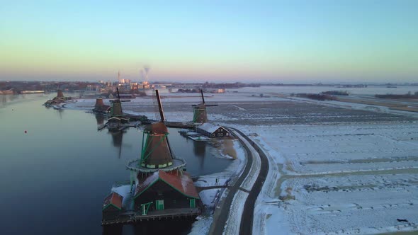 Zaanse Schans Windmill Village During Winter with Snowy Landscape Snow Covered Wooden Historical