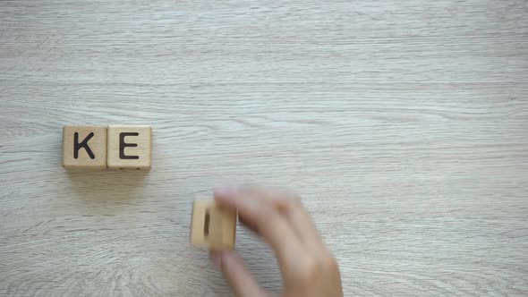 Keep Calm, Hand Putting Words on Wooden Cubes, Positive Thinking and Motivation