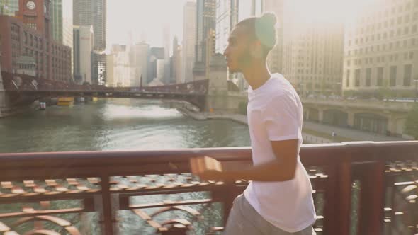 African American man having he morning jog along the Chicago River