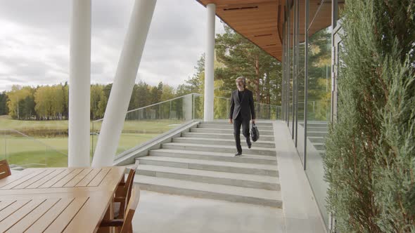 Business-Like Man Leaving Office In Afternoon