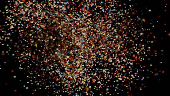 Multicolored Particles Flying After Being Exploded Colorful Rainbow Sprinkles Bouncing Falling Down