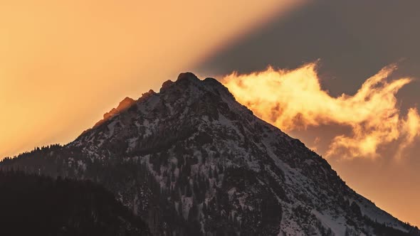 Golden Light of Sun at Sunrise in Mountain Peak