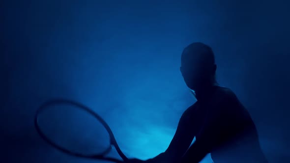Silhouette of Woman Playing Tennis
