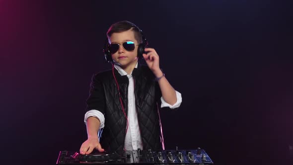 Musical Boy Dj with Glasses Playing on Turntable. Slow Motion alt