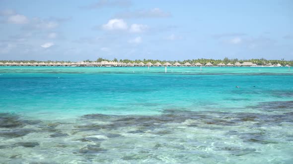 Cruising on a Yacht Around Bora Bora with a View to Turquoise Blue Lagoon