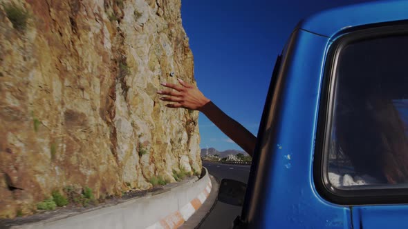 Young woman on a road trip in pick-up truck