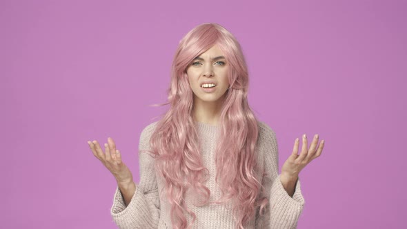 Slowmotion Questioned and Confused Bothered Young Woman in Pink Wig Squinting Look Closer Staring