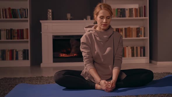 Female Doing Yoga in Apartment