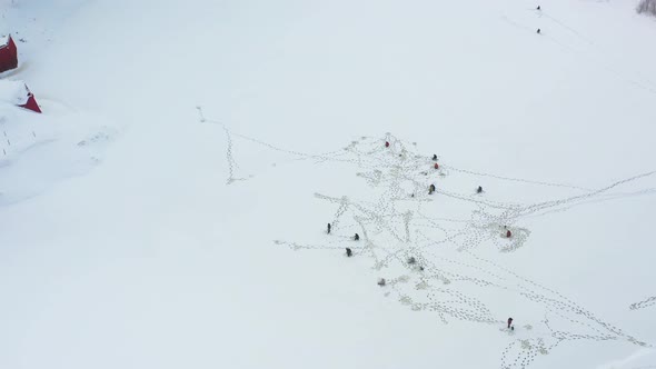 Aerial View Of Fishermen On Frozeen Rivers Ice Catch Fish