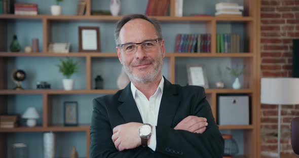 Positive Skilled Bearded Businessman in Glasses Wear Formal Suit Posing on Camera