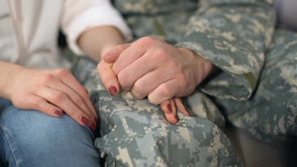 Male Soldier Holding Girlfriends Hand, Farewell Before Military Service, Love