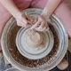 Female Potter Sitting and Makes a Cup on the Pottery Wheel, Woman Making Ceramic Item, Pottery - VideoHive Item for Sale