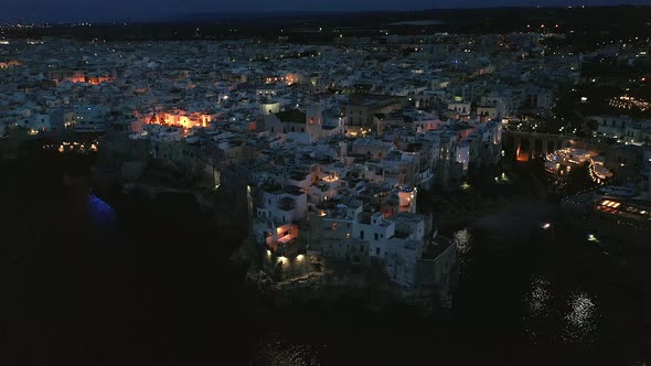 View to historic old town at night, Polognano a Mare, Puglia, Italy