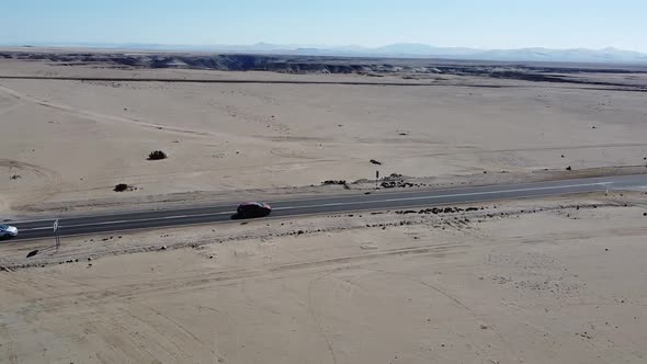 Aerial View of Car Driving on Road in the Atacama Desert, Chile.