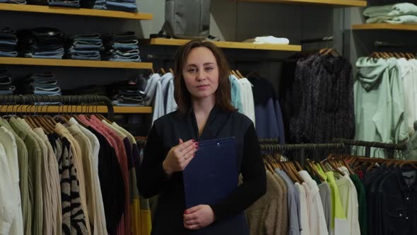 Sales Assistant at Work in a Clothing Store