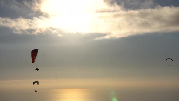 Paragliders With Sunset