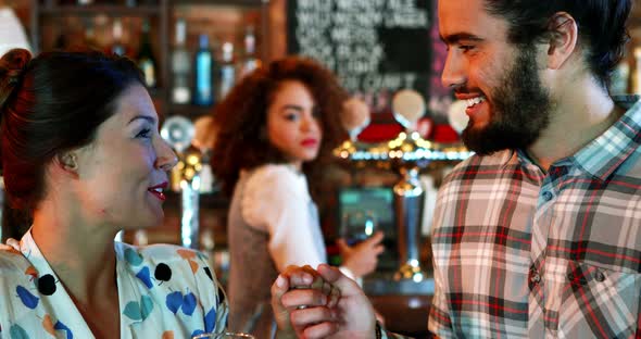 Jealous woman looking at couple flirting with each other