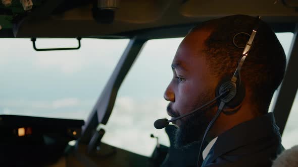 African American Copilot Taking Off with Airplane Captain