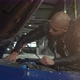 Young Handsome Man Repairing His Car at the Garage - VideoHive Item for Sale