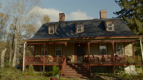 Panning Shot of the Exterior of a Vintage Colonial Times House