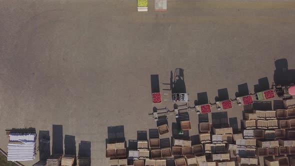 Forklift loading truck with containers full of apples.