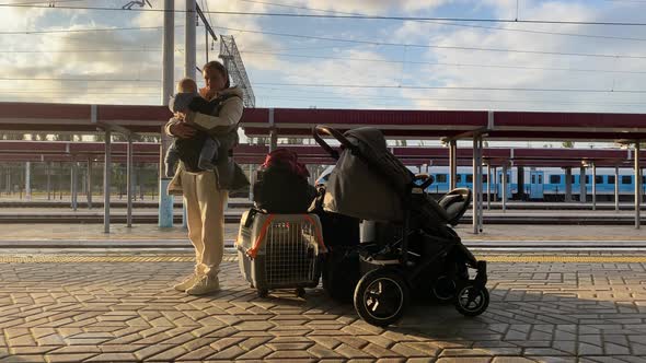Family with Little Child Traveling By Train Woman with Baby and Luggage on Simferopol Railway