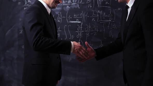 Two Teachers Scientists Make Handshake
