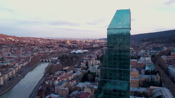 Glass Skyscraper In The Sunset City