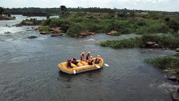 Group of people on a rafting boat waiting to go down the Nile river in Uganda.