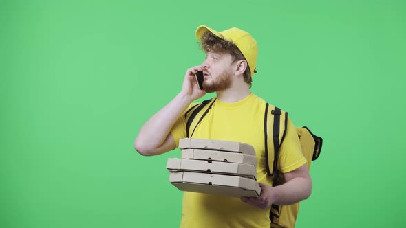 Portrait of Young Men Talking on Phone Drops Pizza Boxes and is Very Upset