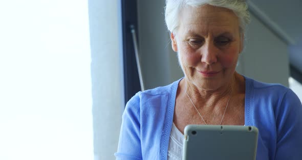 Senior woman using digital tablet 4k