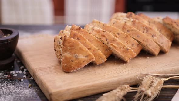 Sliced Fresh Bread on Wooden Cutting Board