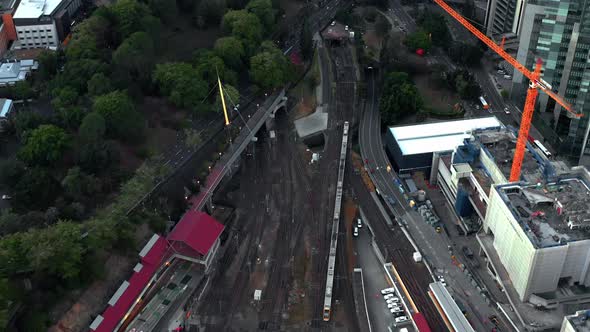 Fly Over Roma Street Station Through King George Square Park In Brisbane Central Business District,