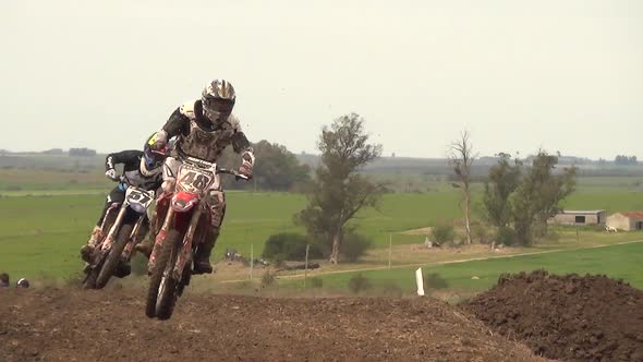 Men racing in a motocross motor sports race.