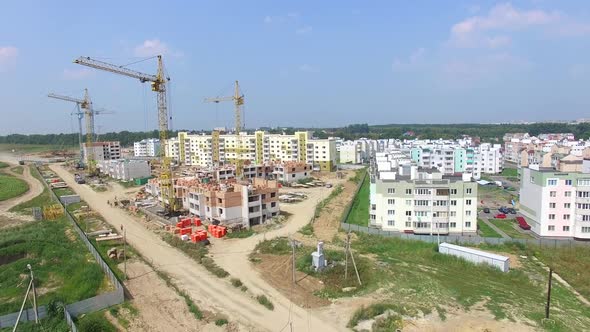 builders are working on the construction of modern high-rise buildings
