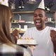 African American guy snuffing out cake candles - VideoHive Item for Sale