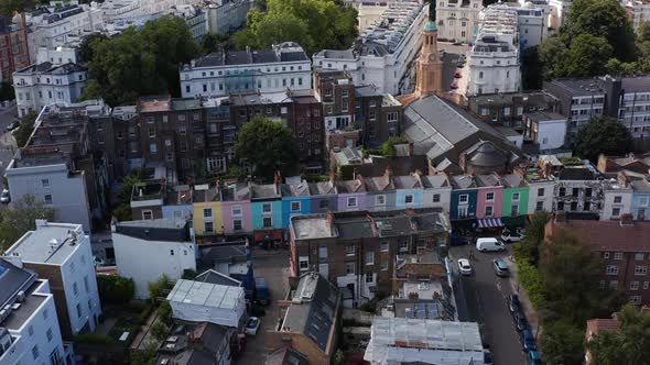 Slide and Pan Footage of Row of Houses with Colourful Facades