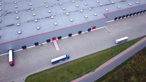 Truck is Driving to Logistics Center. Aerial Shot.