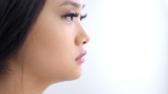 Closeup Face Asian Woman During Creating Beautiful Image of Eyelids with Long Eyelashes